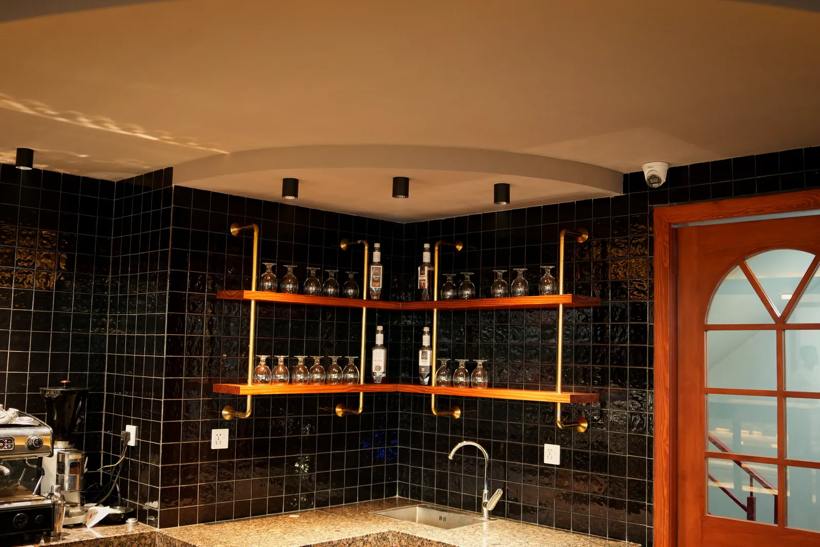 Bar shelves lined with bottles and glassware at Pasta La Vie