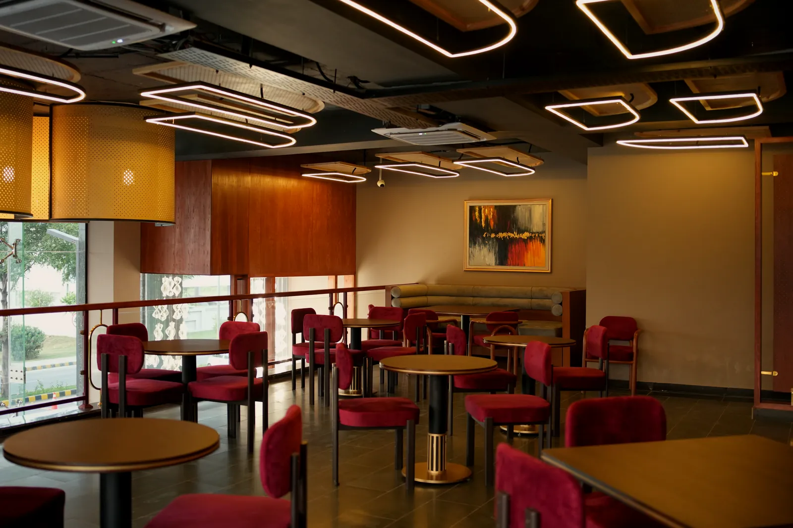 Upstairs dining room with abstract art and ring lights